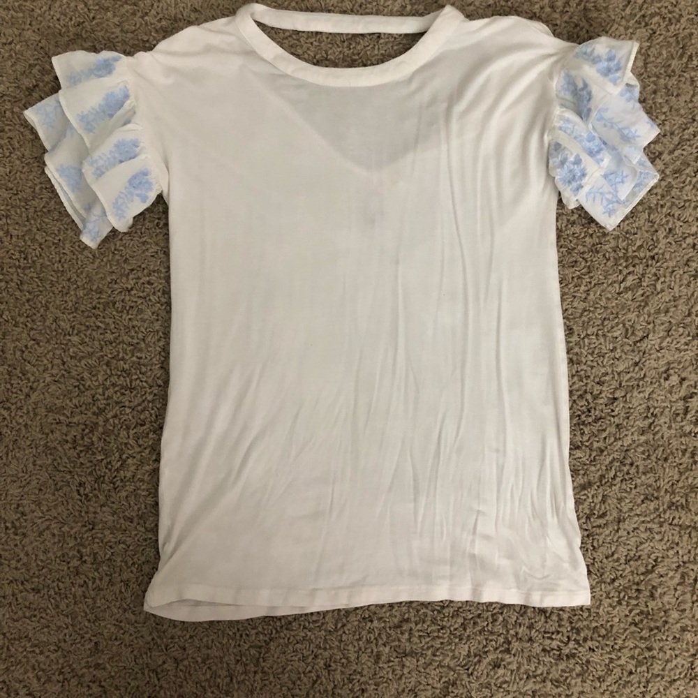 White blouse with blue patterned sleeve